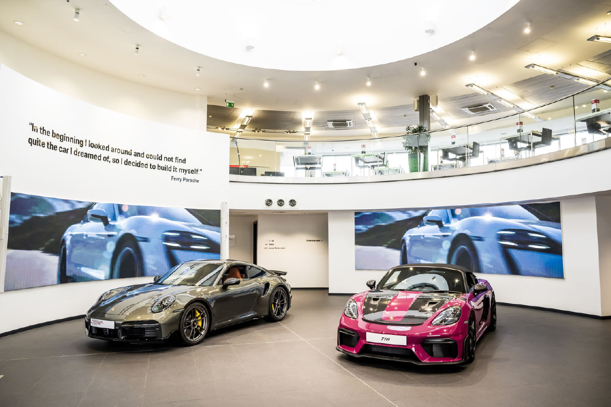 Digital Porsche large format LED and visual content enhancing customer interaction.