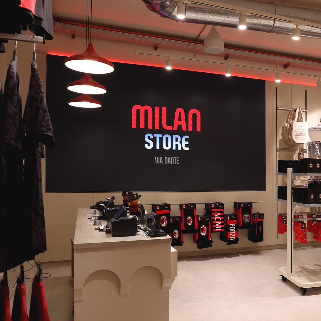 Surround sound system in AC Milan store providing stadium-like audio experience.