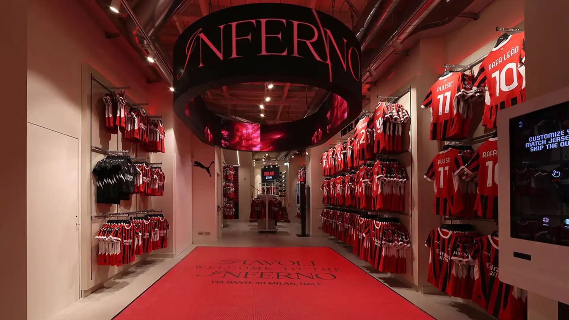Overview of AC Milan store showcasing interactive displays and immersive technology.