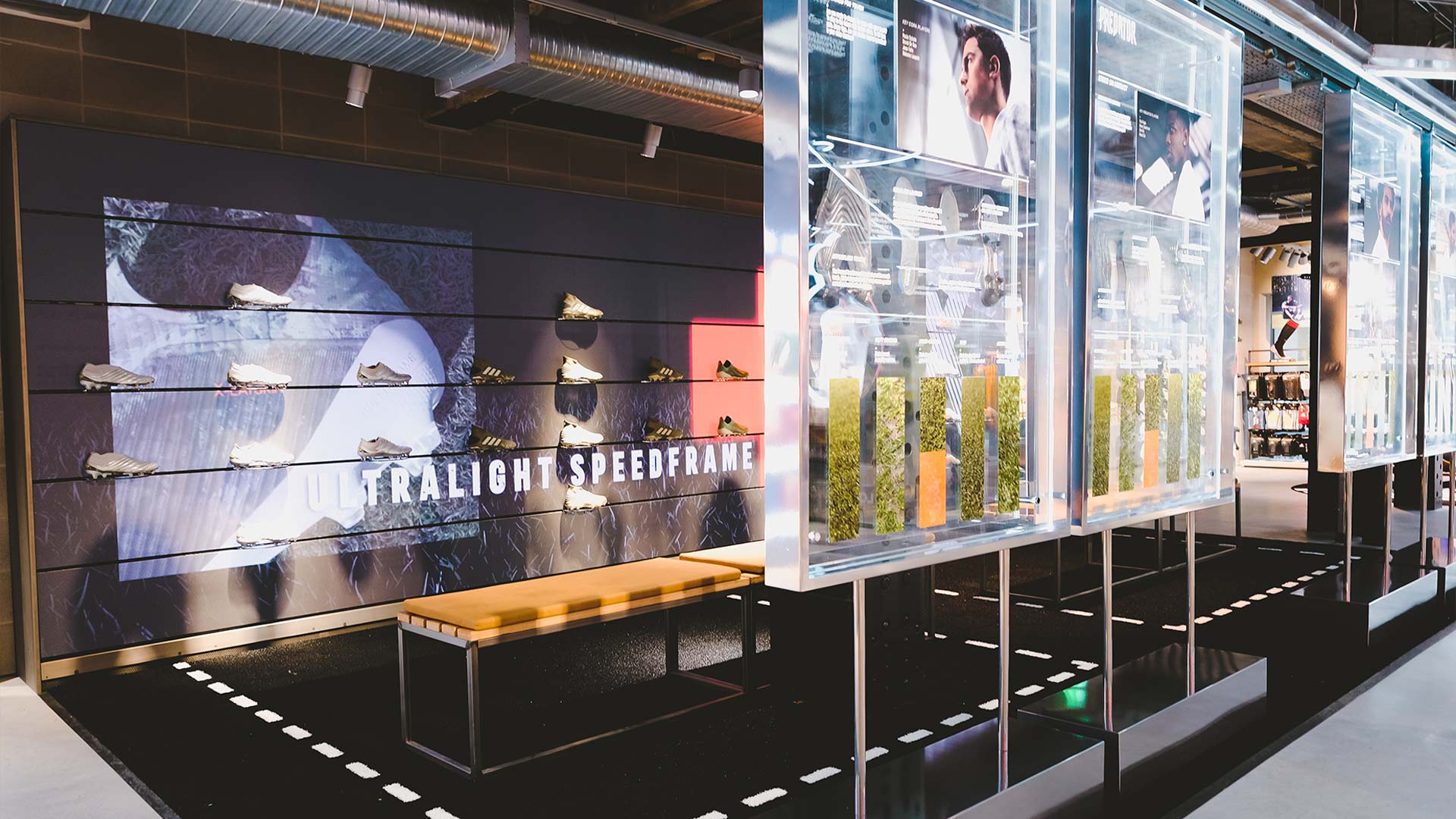 Football zone LED wall and transparent acrylic product display panels in the adidas London flagship store