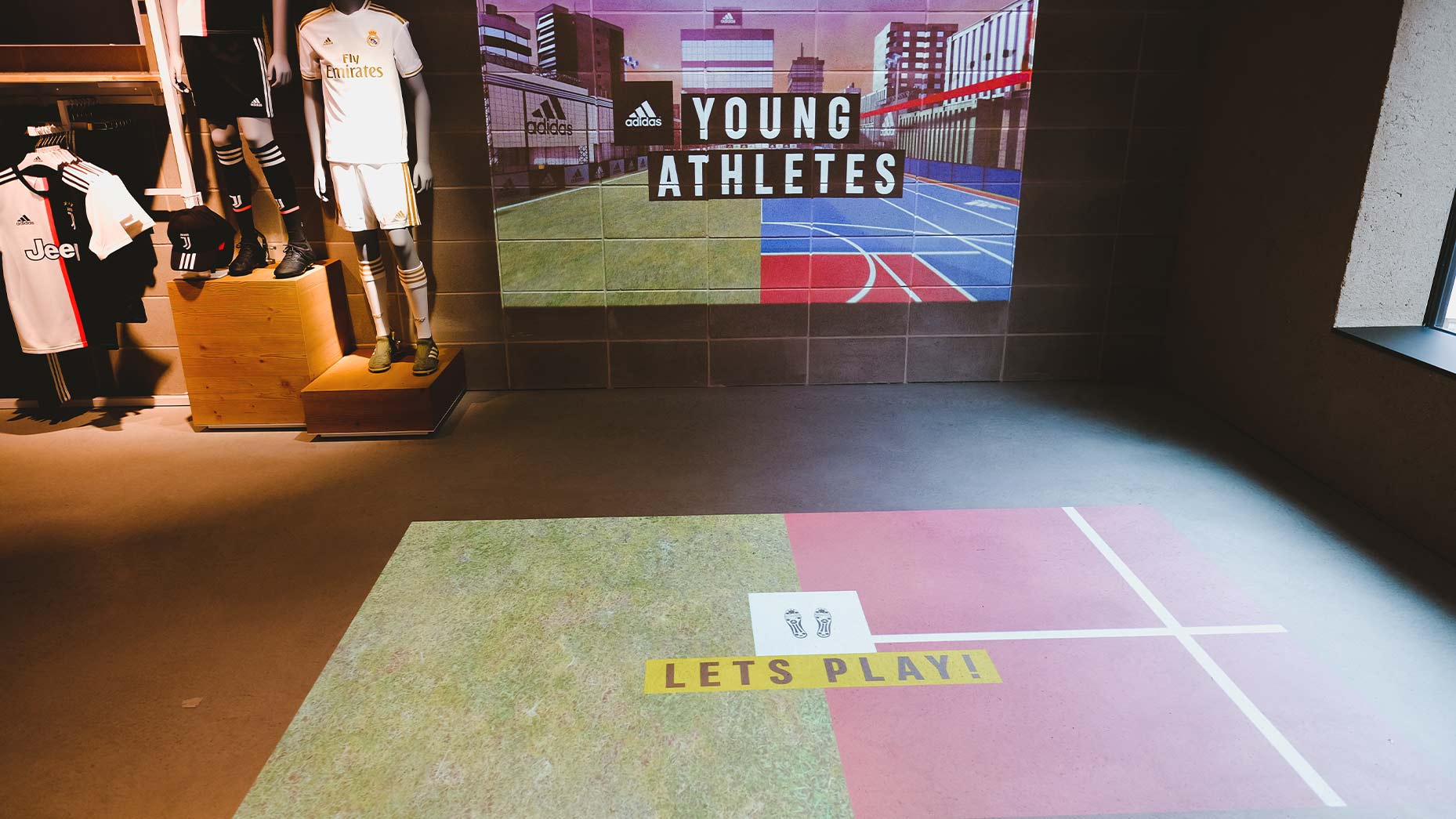 Interactive floor projection and LED tile wall in the Young Athletes zone of the adidas London flagship store