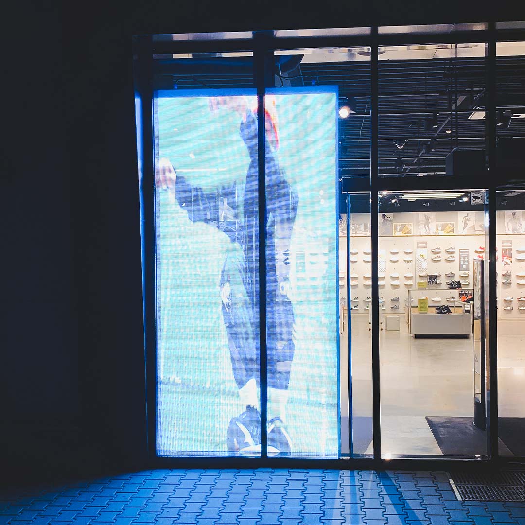 Semi-transparent LED display at the entrance facade of the adidas London flagship store, installed by TRISON