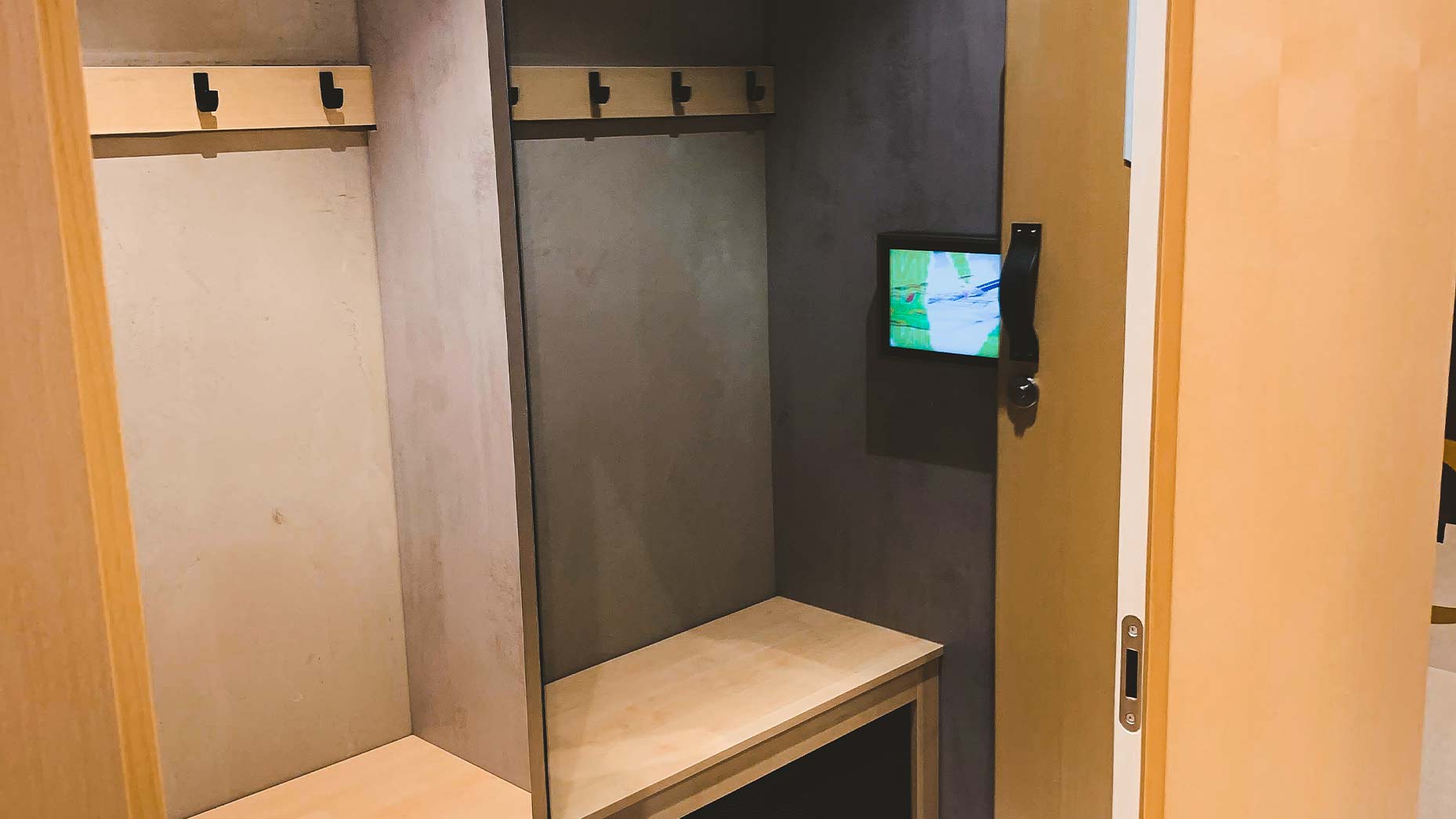 Smart fitting room with integrated digital screen and RFID technology inside the adidas London flagship store
