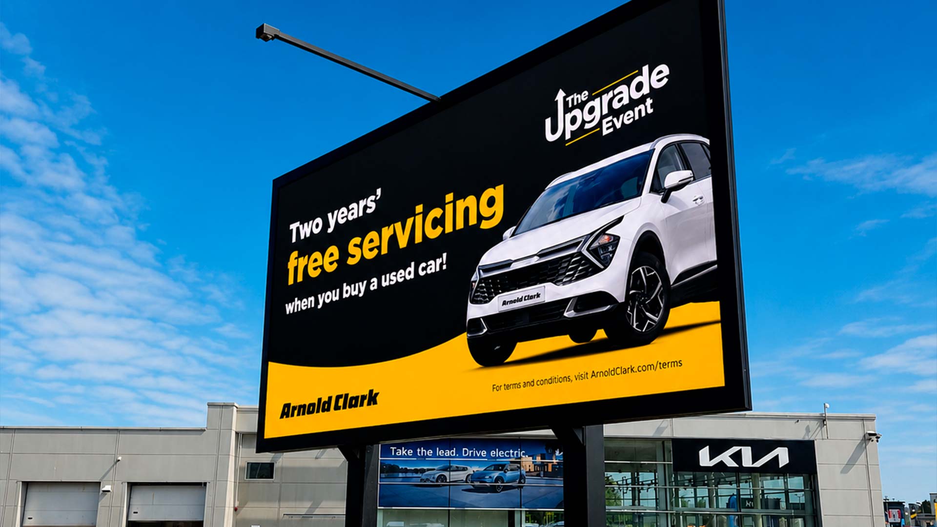 Outdoor LED signage at Arnold Clark Linwood Kia dealership displaying part-exchange promotional offer