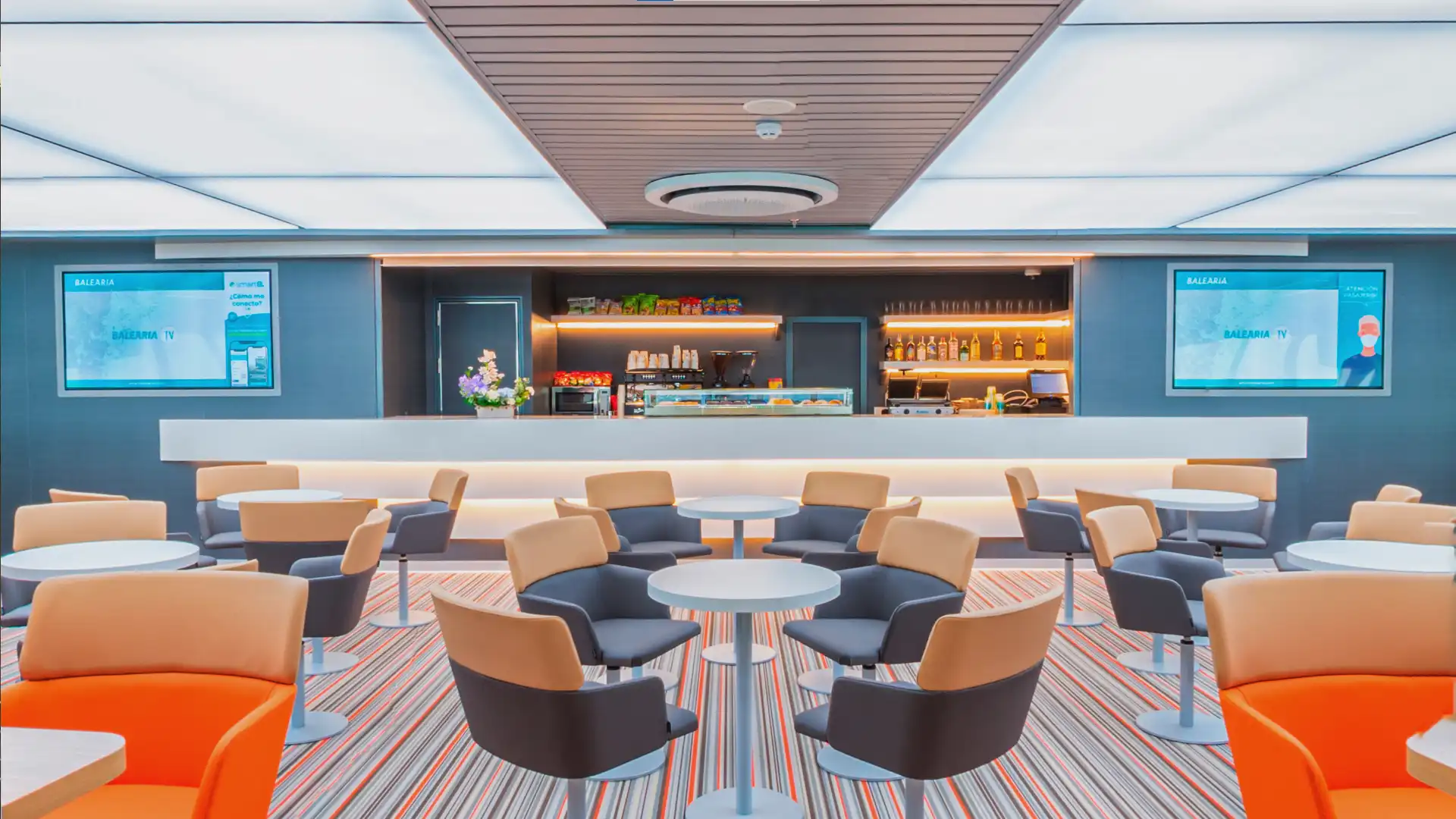 Interior of BALEÀRIA’s Eleanor Roosevelt ferry showcasing audiovisual installations aligned with sustainability and modern design.