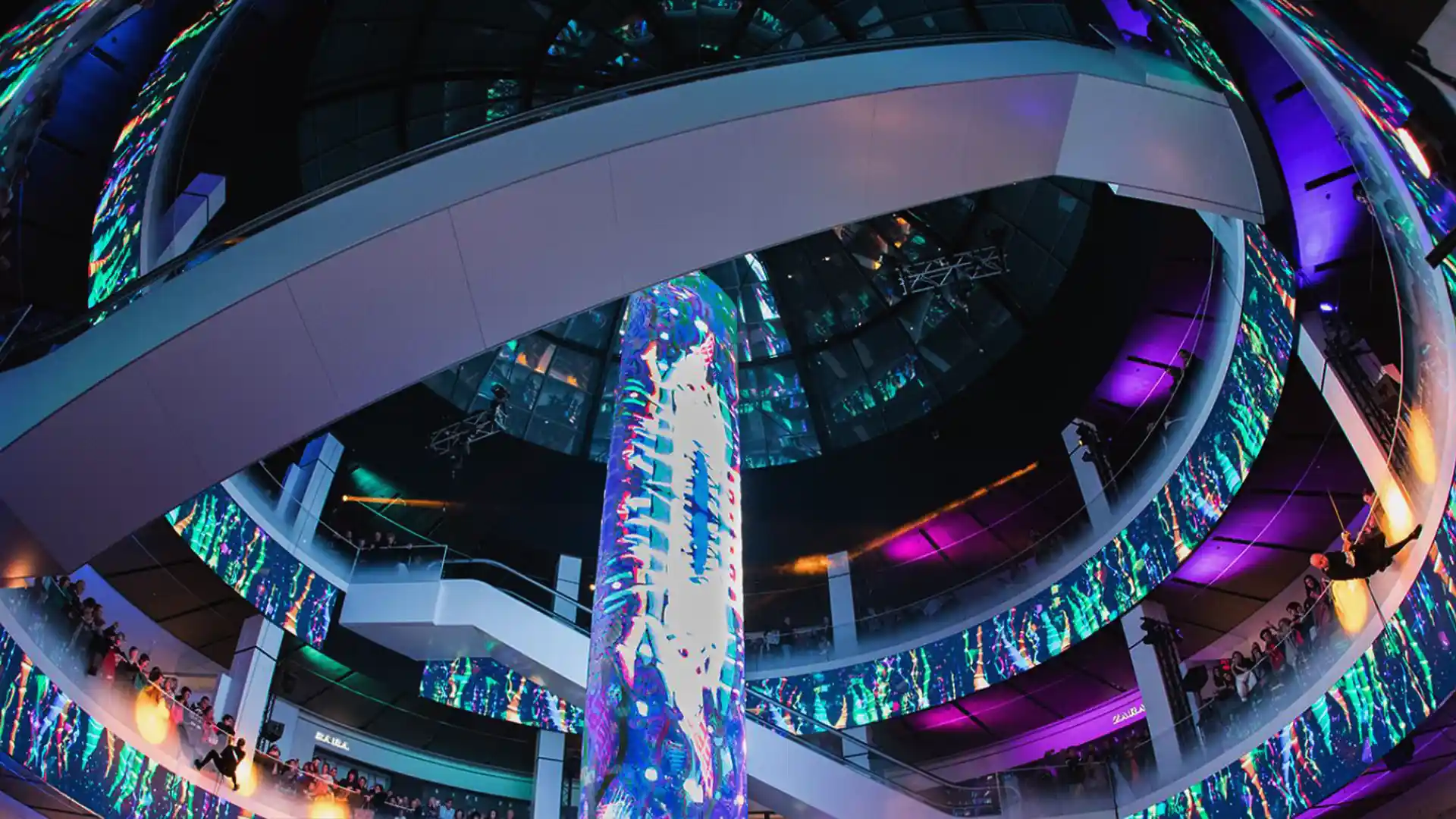 Digital rings and large-scale audiovisual structures integrated into Diagonal Mar architecture.