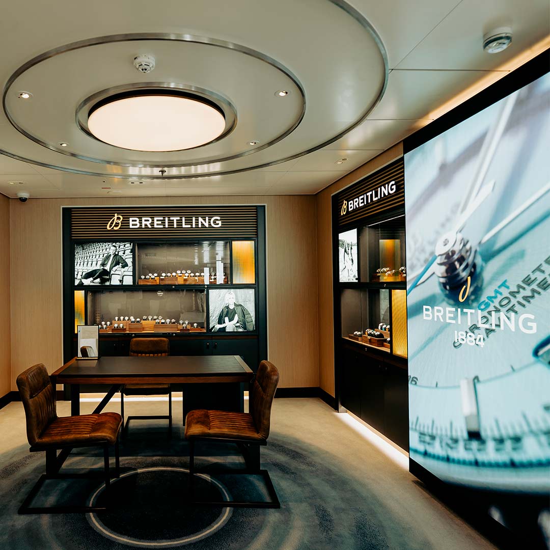 Interior of Breitling duty-free boutique with display wall integrated by TRISON Germany on a cruise ship