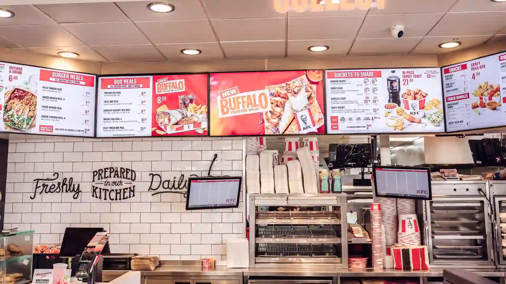 Digital drive thru menu displaying real-time order information at KFC.