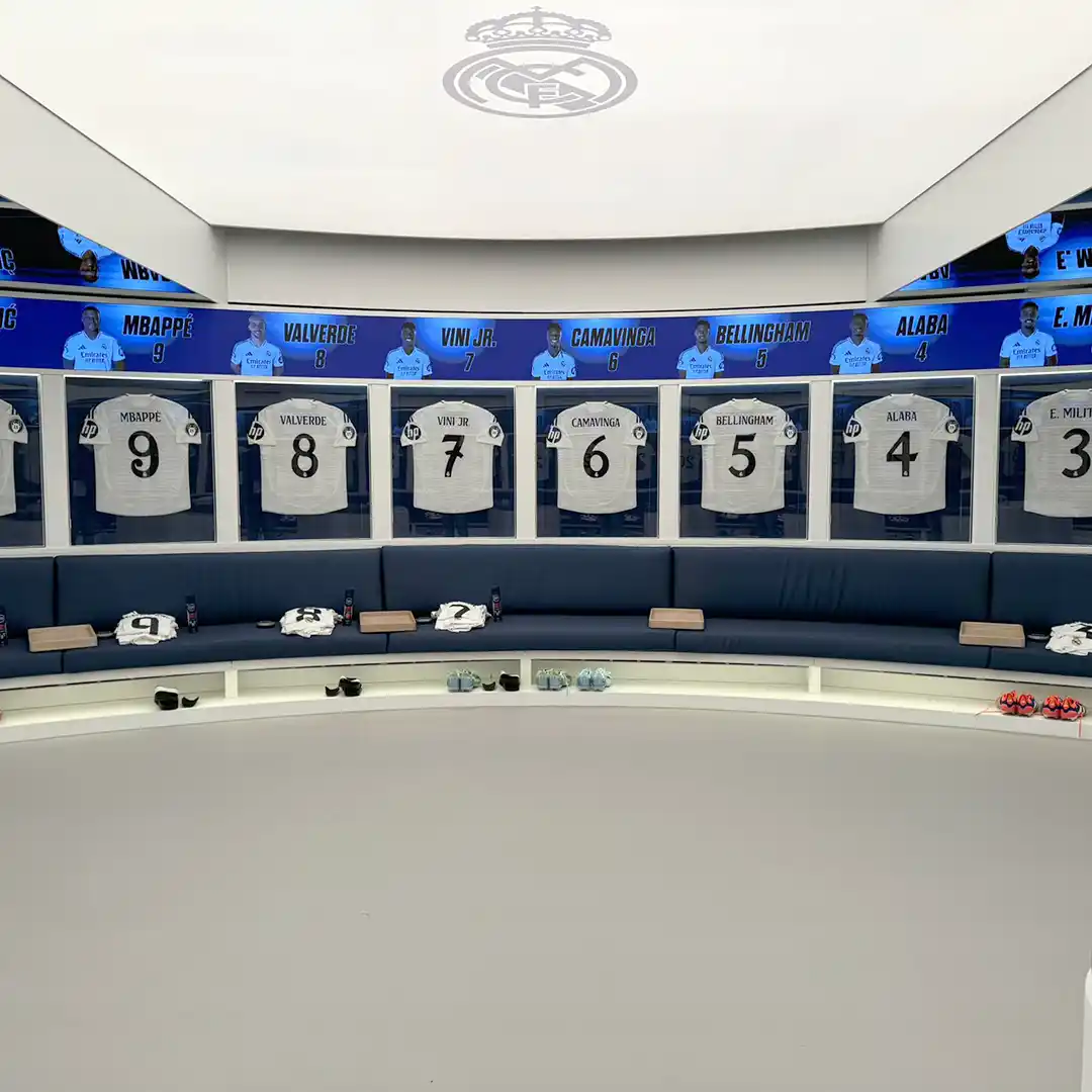 Audiovisual content displayed across the Real Madrid locker room environment at Santiago Bernabéu