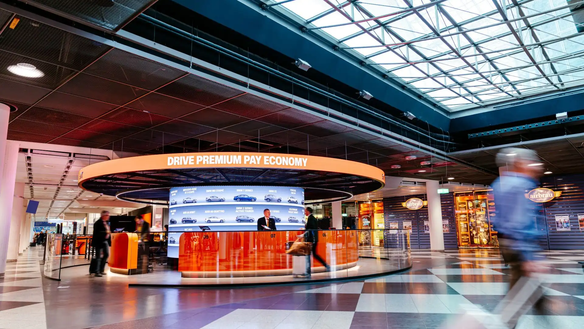 Curved LED column inside the LED ring at the SIXT counter, Munich Airport