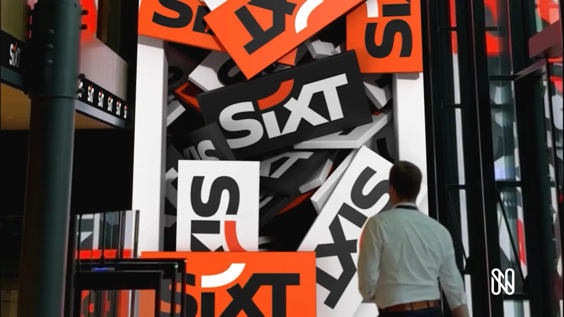 Interior view of SIXT’s digital lobby showing synchronized LED visuals and immersive 3D content designed by TRISON.