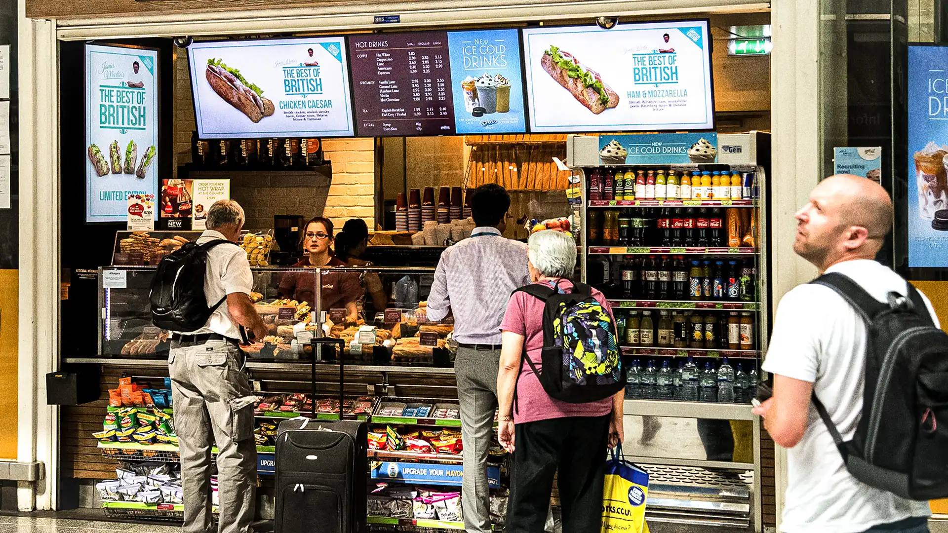 Digital signage showing multi-brand integration at The Mezz, Dublin Airport, managed through TRISON UK’s CMS system.