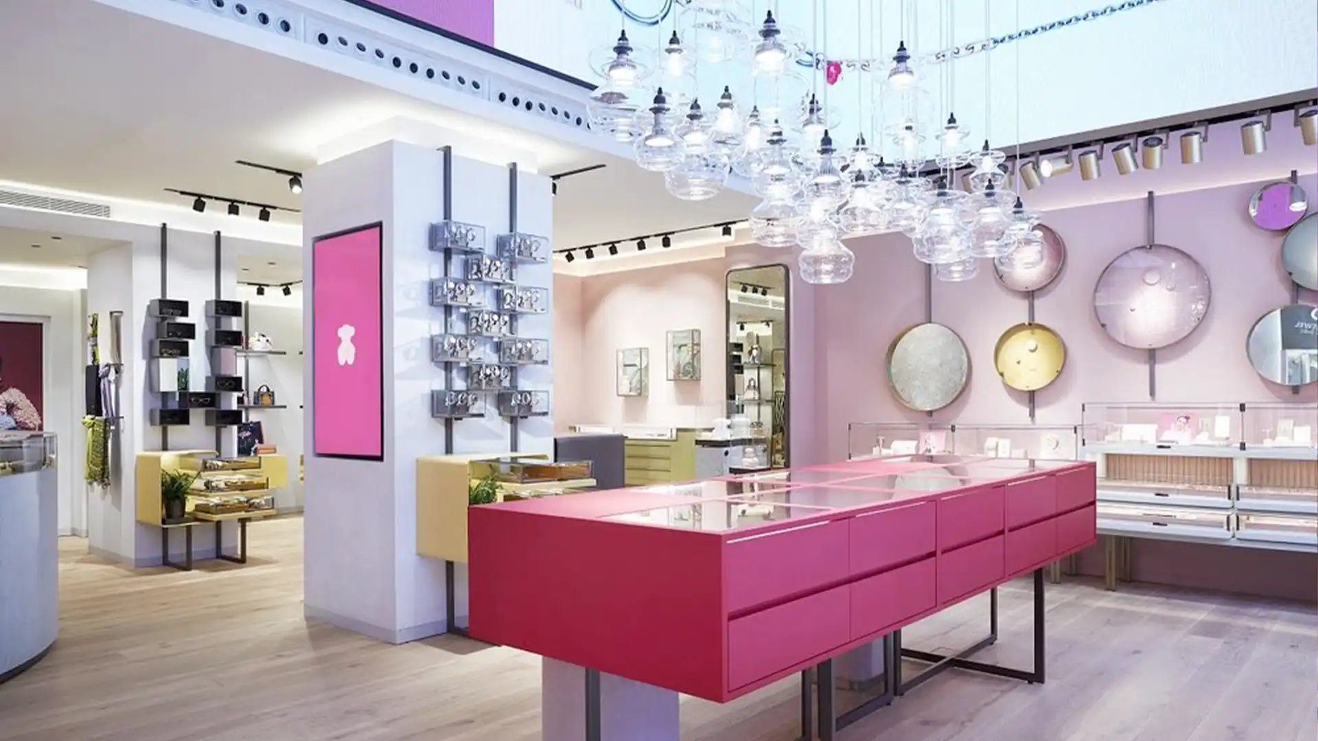 Interno del negozio TOUS di Barcellona con elementi di digital signage integrati.