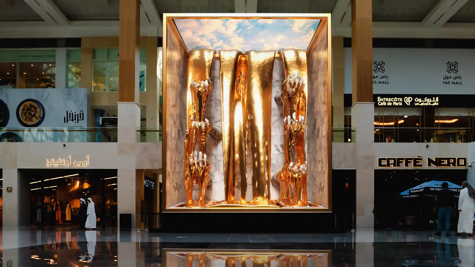 Visitors observing digital installations and interactive elements inside Yas Mall.