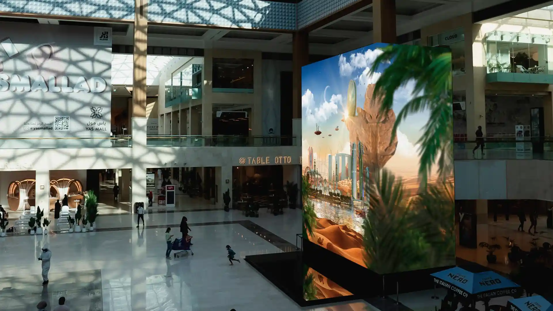 Visitors interacting with augmented reality and digital games at Yas Mall.